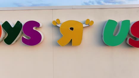 Aerial-truck-shot-reveals-Toys-R-Us-store-sign-on-building
