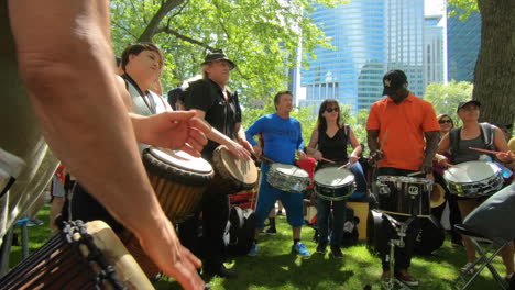 Percussion-performers,-musicians,-band-playing-percussion,-drum-instruments,-rhythm-art,-outside-festival,-tabla,-beat-drummers,-tambourine,-drums-performance