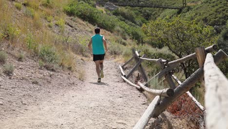 Slow-Motion-Shot-of-a-active-man-going-running-on-the-outdoor-trails-of-Draper-City,-Utah
