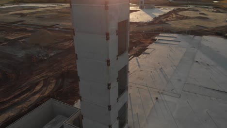 Beautiful-aerial-view-of-a-construction-site-and-structural-concrete-elevator-tower