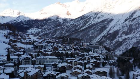 Tilt-down-to-snow-covered-rooftops-in-beautiful-mountain-town