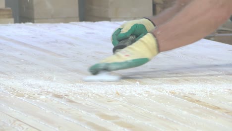 Man-removes-pine-boards-from-excess-wood-glue