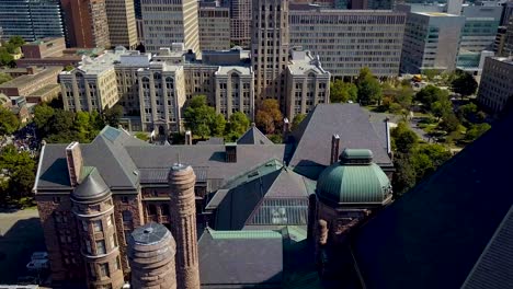 View-of-Ontario-Legislature-and-downtown-Toronto-buildings,-aerial-drone-slide