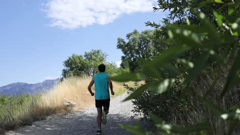 Slow-Motion-Shot-of-a-active-man-going-trail-running-on-the-outdoor-mountainous-trails-of-Draper-City,-Utah