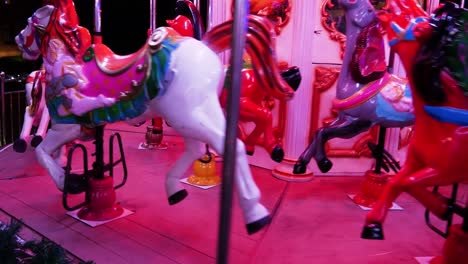 Incredible-colorful-flashing-light-of-vintage-carousel-carnival-fair-merry-go-round-circus-horse-ride-at-amusement-park