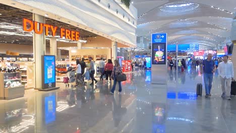 Duty-free-shop-and-people-in-transit-on-new-Istanbul-airport,-Turkey