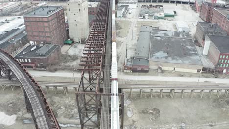 Flyover-above-old-rusted-train-bridge-in-rundown-area-of-St