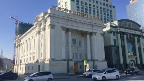 Traffic-Driving-Past-The-Mongolian-Stock-Exchange-In-Ulaanbaatar