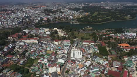 Panning-drone-shot-of-key-buildings-in-city-center-of-Da-Lat-or-Dalat-in-the-Central-Highlands-of-Vietnam-on-sunny-day