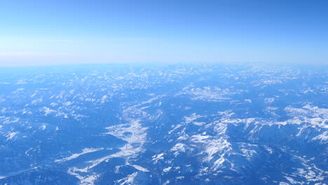 Snow-capped-Alps-mountain-ranges,-establishing-aerial-slow-motion