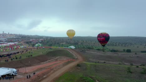 Two-hot-air-ballons-on-a-atv-race-track-Aerial-view-panoramic-shot