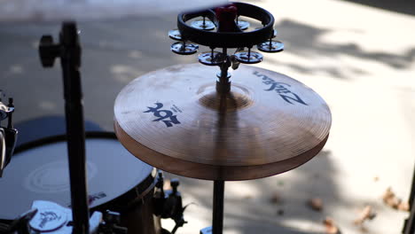 A-drum-set-in-a-garage-band-with-Zildjian-cymbals,-hi-hat-and-percussion-instrument