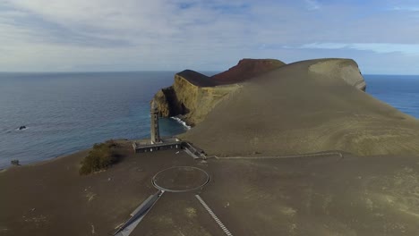Aerial-establishing-shot-of-the-abandoned-Lighthouse-of-Ponta-dos-Capelinhos-in-the-Azores