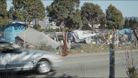 A-homeless-camp-along-the-freeway-in-Berkeley,-California
