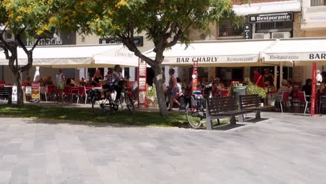 Los-Montesinos,-Alicante,-Spain-:-People-eating-and-drinking-at-Bar-Charly-in-the-Plaza-at-Los-Montesinos