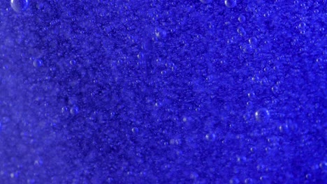 Millions-of-tiny-bubbles-rise-in-a-deep-blue-current,-this-is-very-relaxing-to-watch-and-could-make-an-interesting-background-for-green-screen