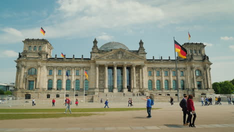 A-Group-Of-Tourists-Enters-The-Bundestag-Building-In-Berlin
