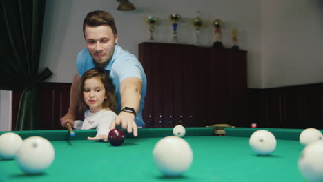 Man-and-Daughter-Play-Billiards