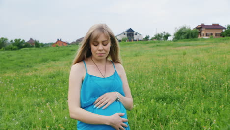 Pregnant-Woman-Walking-in-a-Meadow