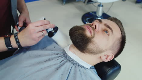 Barber-Shaping-A-Client's-Beard