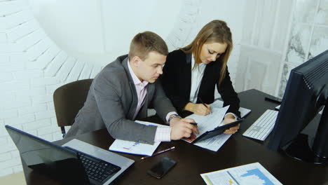 Young-Businesswoman-Working-With-Her-Assistant