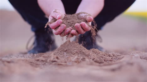 Farmer-Examining-Organic-Soil-In-Hands-Farmer-Touching-Dirt-In-Agriculture-Field-18