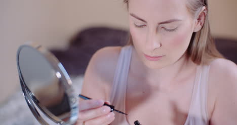 Woman-Doing-Makeup-Painting-Eyelashes-With-Mascara-5