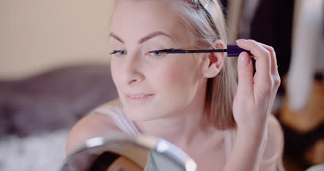 Woman-Doing-Makeup-Painting-Eyelashes-With-Mascara-12