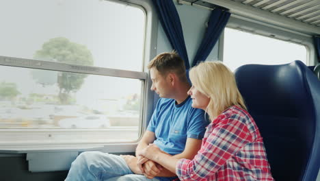 Couple-Look-Out-Train-Window