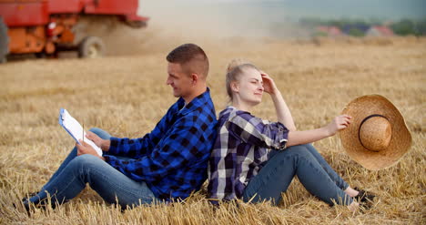 Young-Farmers-Discussing-At-Wheat-Field-1