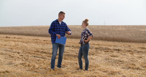Young-Farmers-Discussing-At-Wheat-Field-30