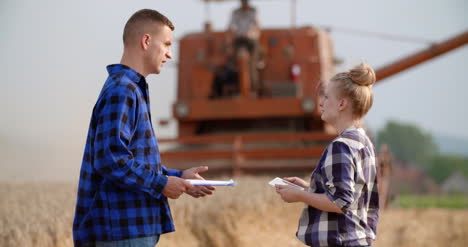 Young-Farmers-Discussing-At-Wheat-Field-31