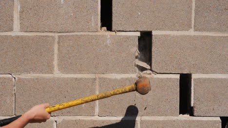 Smashing-Wall-With-A-Hammer