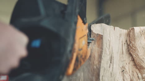 Cutting-Through-Wood-With-Chainsaw-In-Slow-Motion-1