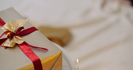 Closeup-Of-Christmas-Gift-Box-Tied-With-Ribbon