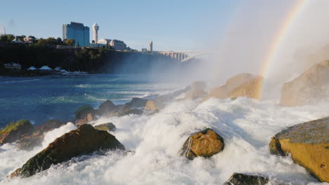 Rocks-at-Foot-of-Niagara-Falls-With-Cityscape