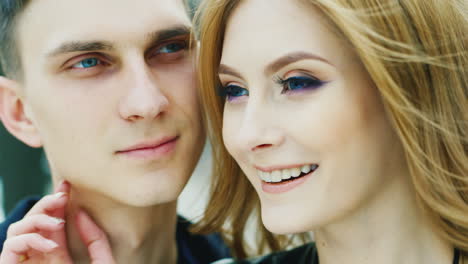 Portrait-Of-A-Young-Couple-20-25-Years-Look-Into-The-Distance-Smiling-Very-Happy