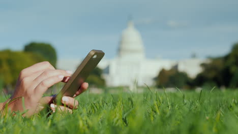 Hands-Using-Smartphone-By-Capitol-Building