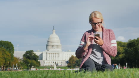 Woman-Uses-Phone-by-US-Capitol-Building