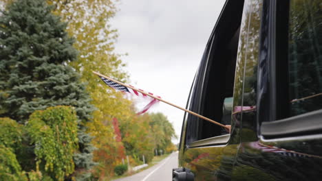 USA-Flag-Flying-From-Car-Window