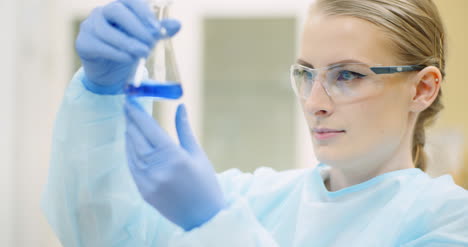 Female-Scientist-With-A-Pipette-Analyzes-A-Liquid-At-Laboratory
