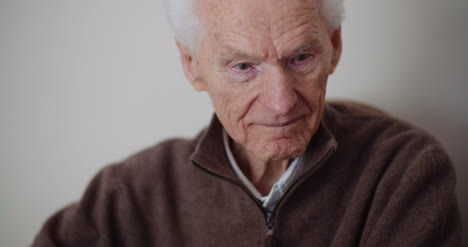 Elderly-Senior-Man-Smiling-Into-Camera