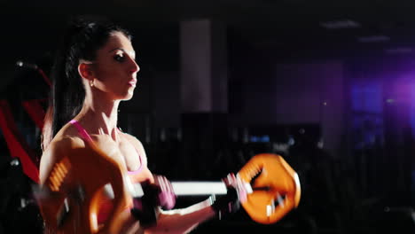 Athletic-Woman-Trains-Muscles-Of-The-Hands-With-A-Barbell-Female-Bodybuilding
