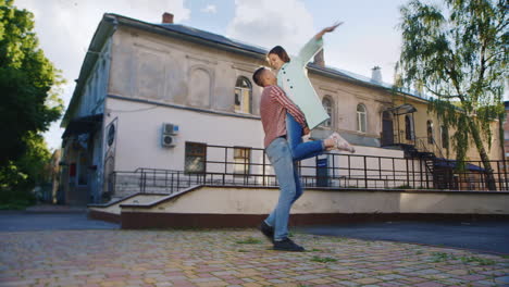 Loving-Couple-Embracing-In-The-Sun-Against-The-Background-Of-An-Old-Building-Hd-Video