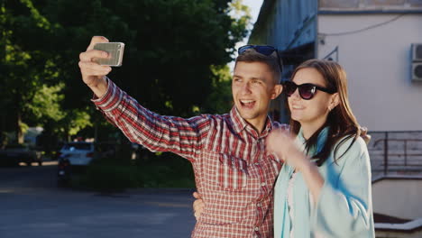 A-Loving-Couple-Makes-Selfie-In-The-Rays-Of-The-Sun-Outdoors-Hd-Video