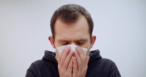 Man-With-Coronavirus-Symptoms-Wearing-Protective-Mask-1