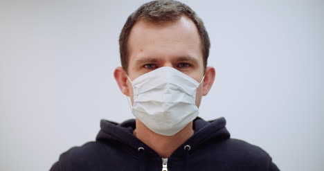 Man-With-Coronavirus-Symptoms-Wearing-Protective-Mask-2