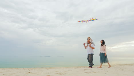 Friendly-Young-Family-Playing-With-Daughter-Fly-A-Kite-01