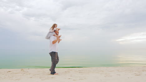 Young-Dad-Walking-With-Daughter-on-Shoulders-01