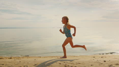 Carefree-Blonde-Girl-5-Years-Runs-Along-The-Shore-He-Laughs-Off-Her-Feet-Flying-A-Lot-Of-Water-Splas